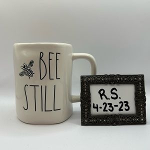 Rae Dunn 🐝”Bee Still” mug with yellow inside.